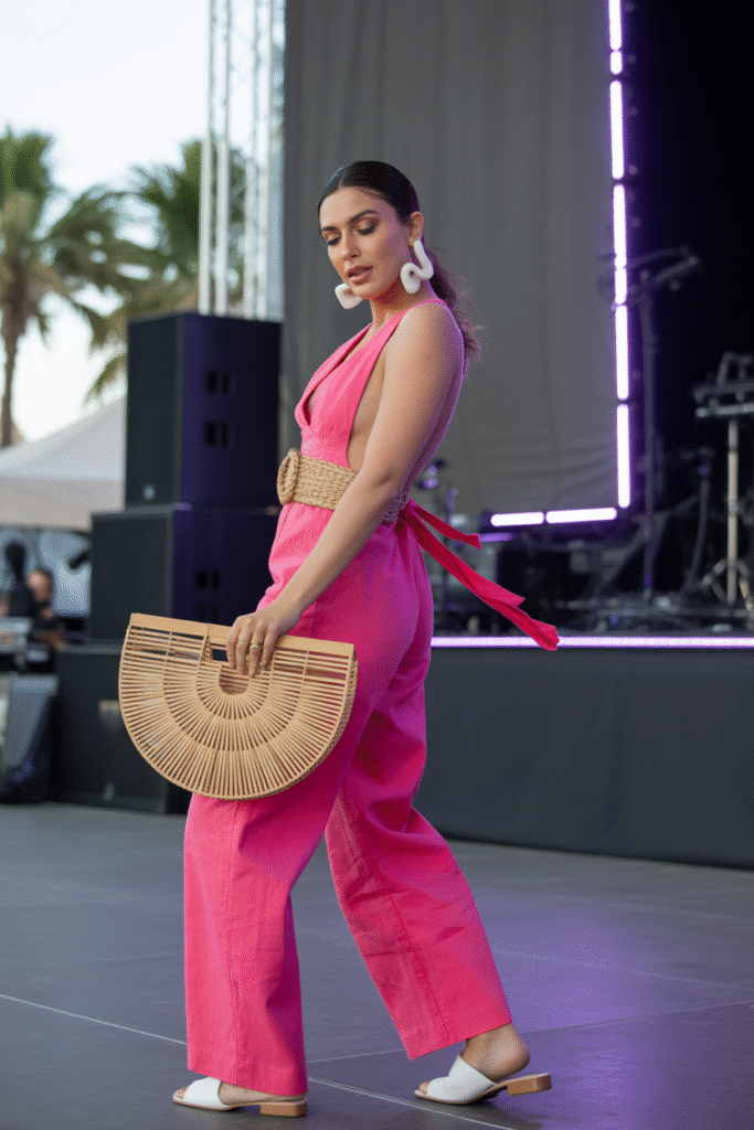 10 Stylish Party Outfits Ideas for Women to Elevate Your Look 4 Hot Pink Jumpsuit and Sculptural Earrings